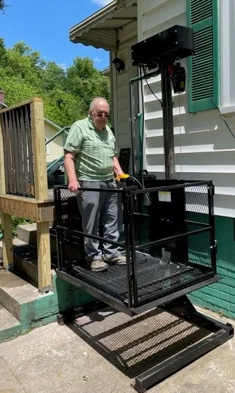 Residential platform lift at a covered entrance