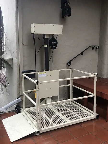 Platform lift integrated beside existing stairs