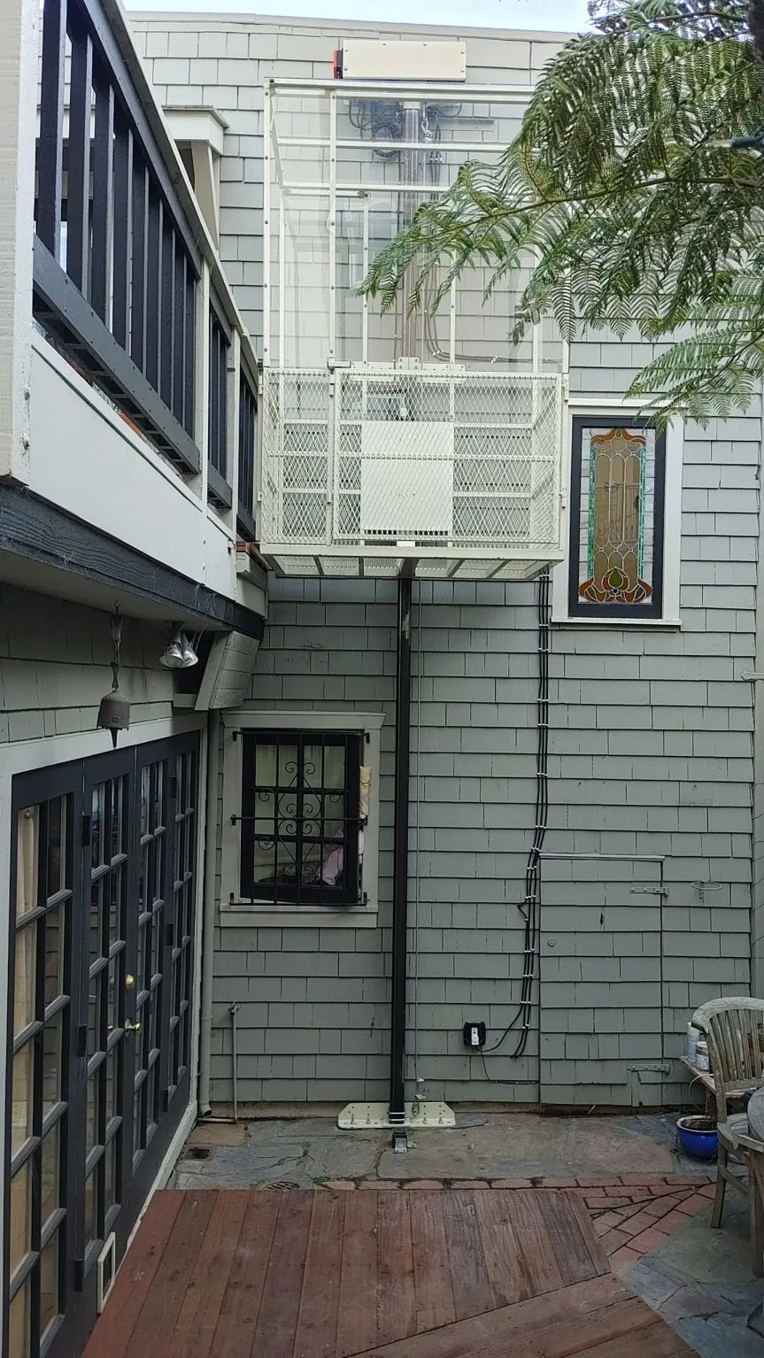 Garage access lift with full travel path visible
